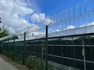 Coil Razor Wire Atop Mesh Fence Bolton